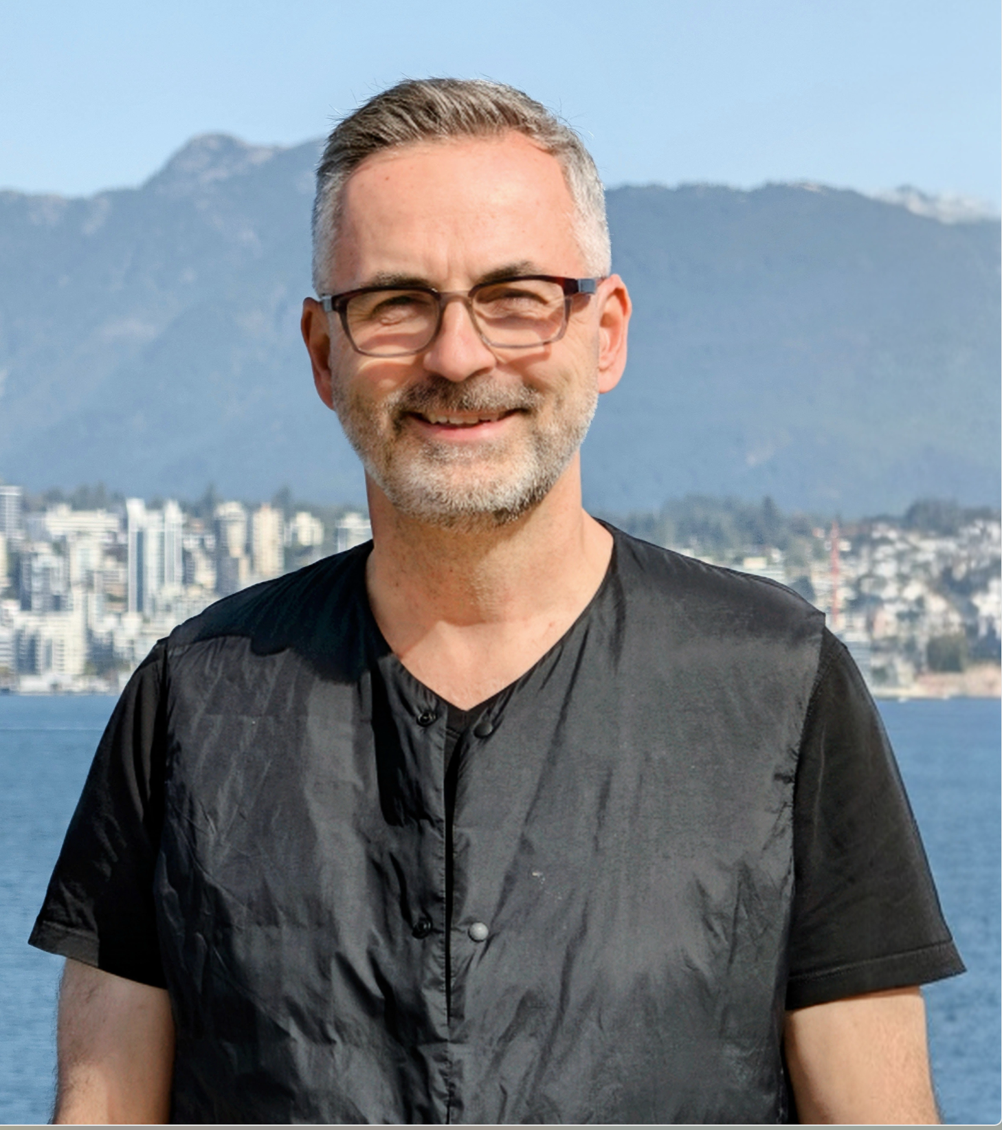 Dave Kurvers with the City of North Vancouver and North Shore mountains in the background